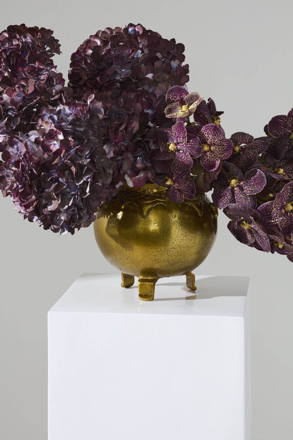 gold bubbling pot cauldron with floral arrangement